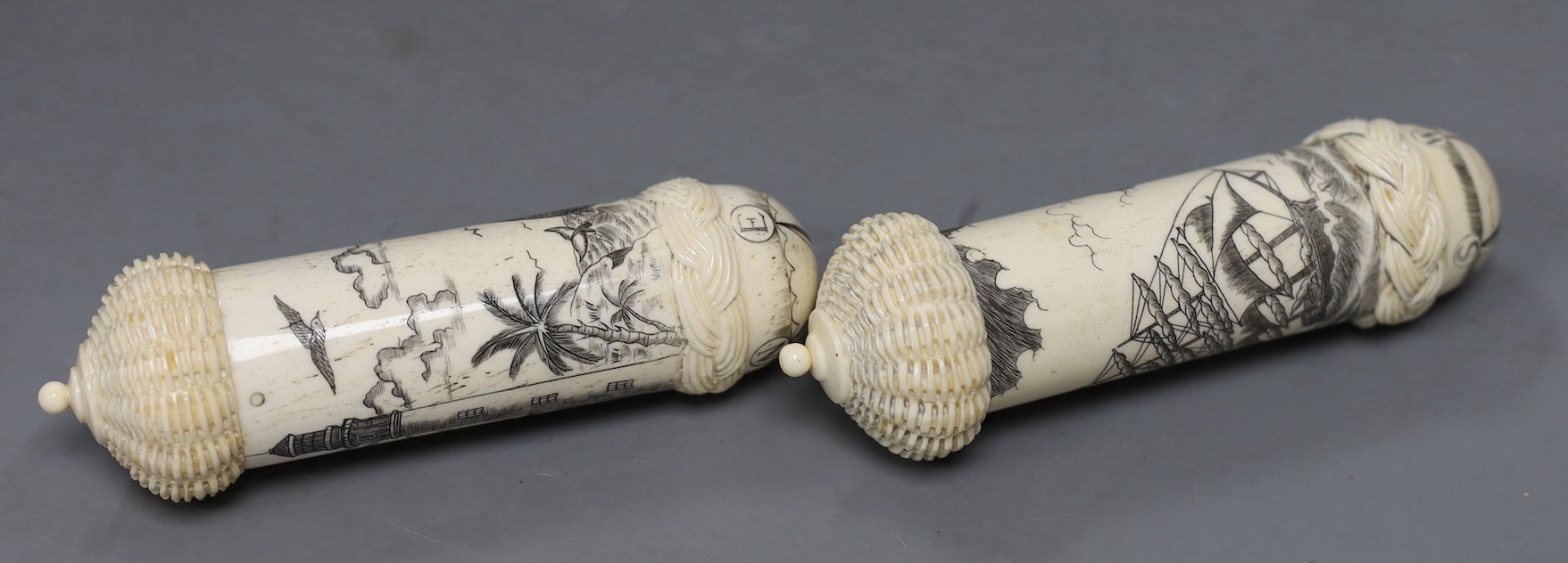 Two bone scrimshaw needle cases, 12cms high